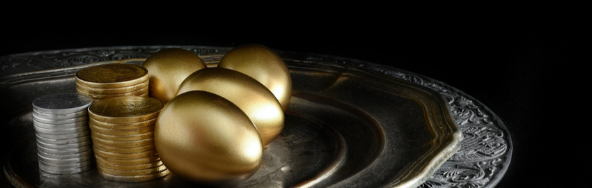 golden eggs and coins served on a silver tray